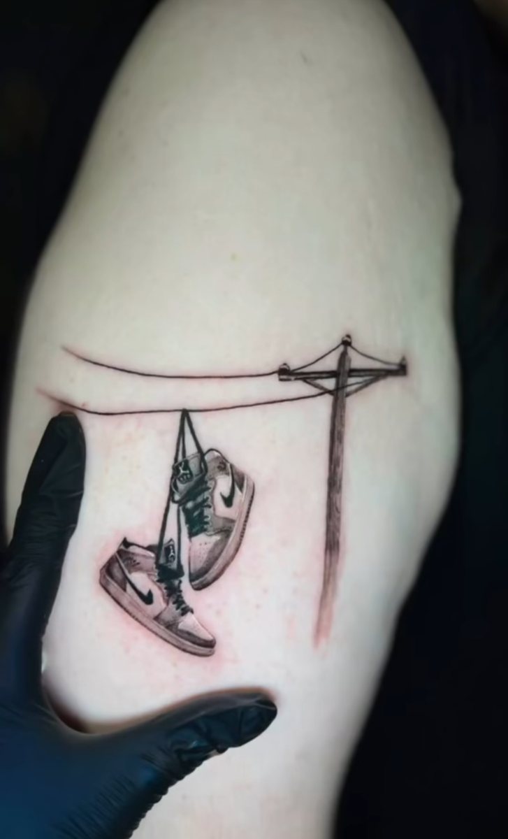 Hanging sneakers, black and grey
